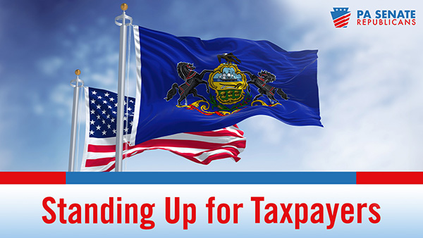 US flag flying behind the PA flag with the words Standing Up for Taxpayers beneath them.